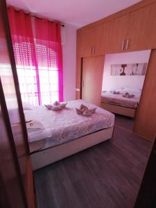 Cama o camas de una habitación en ENJOY Apart Centro y Playa ZANCA