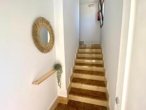 a stairway with a mirror and a mirror at La espiga de Segovia 2 in La Lastrilla