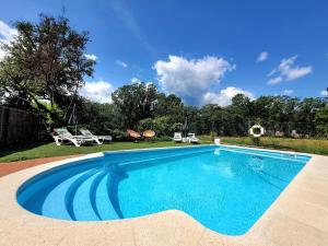 an image of a swimming pool in a yard at Harveys Homestay - Adults only in Mieras