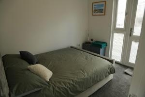 Postel nebo postele na pokoji v ubytování 408 Sea View Road