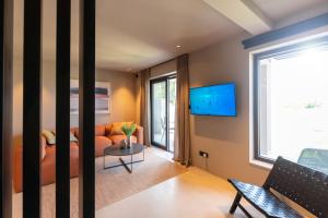 a living room with a couch and a window at MOLAJ, Holiday House in Nova Vas