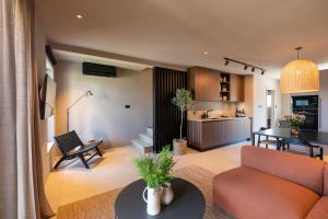 a living room with a couch and a table at MOLAJ, Holiday House in Nova Vas