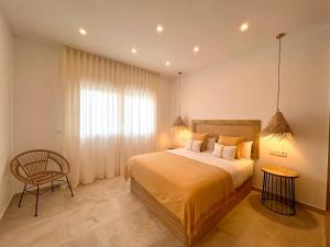 Ένα ή περισσότερα κρεβάτια σε δωμάτιο στο Angeles Beach II by ELE Apartments +18 φωτογραφίες