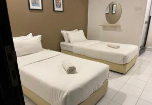 Postel nebo postele na pokoji v ubytování 1108 Hotel Sungkai