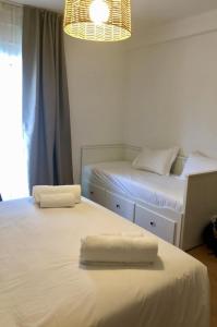 Un pat sau paturi într-o cameră la Casa da Praia - Manta Rota