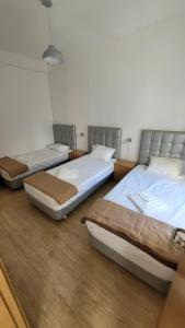 three beds are lined up in a room at Stay in Sintra in Sintra