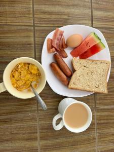 a plate of breakfast food with eggs bacon and toast at Jazby Guest House, Naivasha in Naivasha
