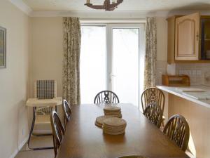a kitchen and dining room with a table and chairs at Sea Haven - Uk44499 in Hope Cove