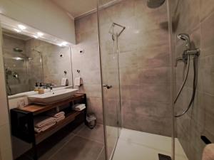 a bathroom with a sink and a glass shower at A2D1 Mali Losinj in Mali Lošinj +34 photos