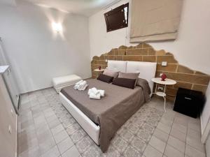 Postel nebo postele na pokoji v ubytování B&Beach Ospitalità Siciliana