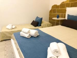 Postel nebo postele na pokoji v ubytování B&Beach Ospitalità Siciliana