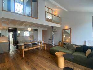 a living room with a couch and a table at Loft Cathédrale in Bayonne