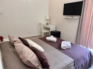 TV a/nebo společenská místnost v ubytování B&Beach Ospitalità Siciliana