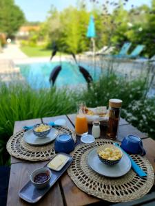 a picnic table with food and drinks on it at La Villa Hossegor in Hossegor