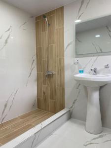 a bathroom with a shower and a sink and a mirror at ECO PARK RESORT in Ijevan
