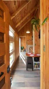 a hallway of a house with a desk in it at Tinyhouse Licanray in Licán Ray