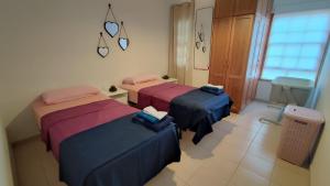 Ένα ή περισσότερα κρεβάτια σε δωμάτιο στο Apartamento Arenita