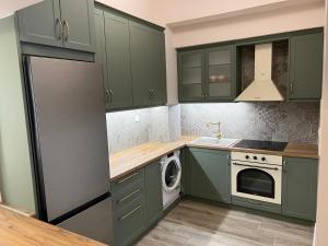 Kuchyň nebo kuchyňský kout v ubytování Loutraki apARTment