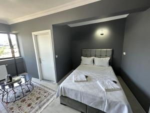 Postel nebo postele na pokoji v ubytování Arena Resort Otel Kagıthane