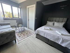 Postel nebo postele na pokoji v ubytování Arena Resort Otel Kagıthane