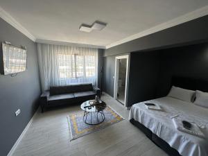 Postel nebo postele na pokoji v ubytování Arena Resort Otel Kagıthane