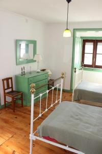 Un pat sau paturi într-o cameră la Casa de Tagarro
