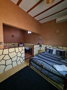 Postel nebo postele na pokoji v ubytování Riad Tigmi du Soleil