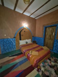 Postel nebo postele na pokoji v ubytování Riad Tigmi du Soleil