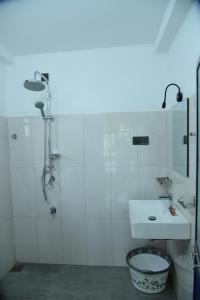a bathroom with a shower and a sink at Sadisa Villa in Hikkaduwa +14 photos