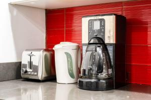 a coffee maker and a toaster on a counter at 809-3B Columbus Circle W D new BLDG Balcony in New York