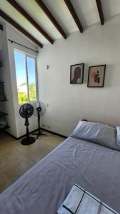 a bedroom with a bed and a window at Apartasol Club Ciudadela Santa Fe - Santa Fe de Antioquia in Santa Fe de Antioquia +53 photos