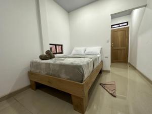 Postel nebo postele na pokoji v ubytování Tuanis Guest House + 8 fotografií
