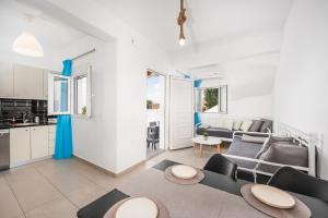 a living room with a couch and a table at Anzuelo Apartments in Megalochori