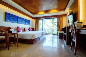 Postel nebo postele na pokoji v ubytování Khaolak Orchid Beach Resort - SHA Extra Plus + 37 fotografií