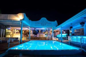 a swimming pool at night with blue lights at Paraga View in Paraga