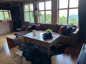 a living room with a couch and a coffee table at Hytto in Håra