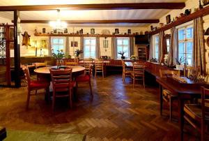 a large dining room with a table and chairs at Chalupa Sněhurka in Polubný