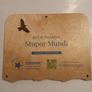 a sign that reads bed and breakfast super muni at B&B Stupor Mundi in Altamura