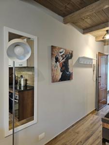 a living room with a painting on the wall at Moda Apartments 69 in Sestriere