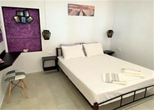 Postel nebo postele na pokoji v ubytování Ionion Seaside Home