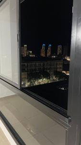 a view of a city at night from a window at Cafferata in Rosario