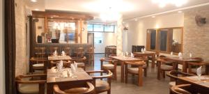 a restaurant with tables and chairs in a room at SOA LIA HOTEL in Miandrivazo