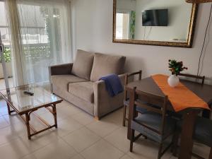 a living room with a couch and a table at ESPIGALL in Vilanova i la Geltrú