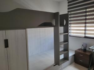 a bedroom with a bunk bed and a window at ESPIGALL in Vilanova i la Geltrú