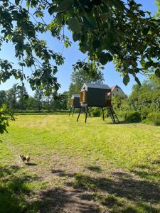 a tiny house on a tripod in a field at Posedy Panský dvůr Telč in Telč