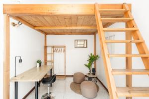 a loft office with a ladder and a desk at Imperial Nazionale in Rome