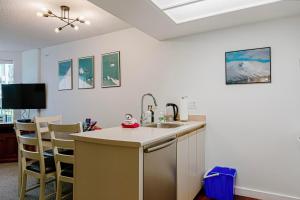 a kitchen with a sink and a counter top at 1 bed family friendly condo on quiet Blackcomb - sleeps 5 in Whistler