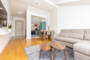 a living room with a couch and a table at Apartment 29 in Kotor +9 photos