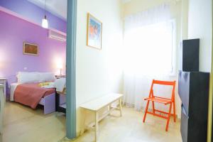 A bed or beds in a room at Kaminaki Beachfront Apartments