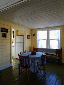 a dining room with a table with a blue table cloth at Dory Buff House in Princeton